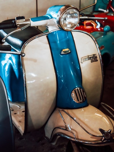 The parking lot of blue and white motorcycles
